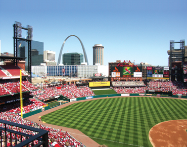 St. Louis Cardinals neon sign with downtown from Busch Stadium