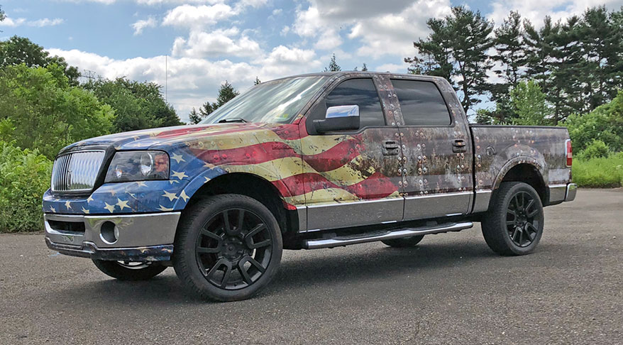 car covered in US flag paint