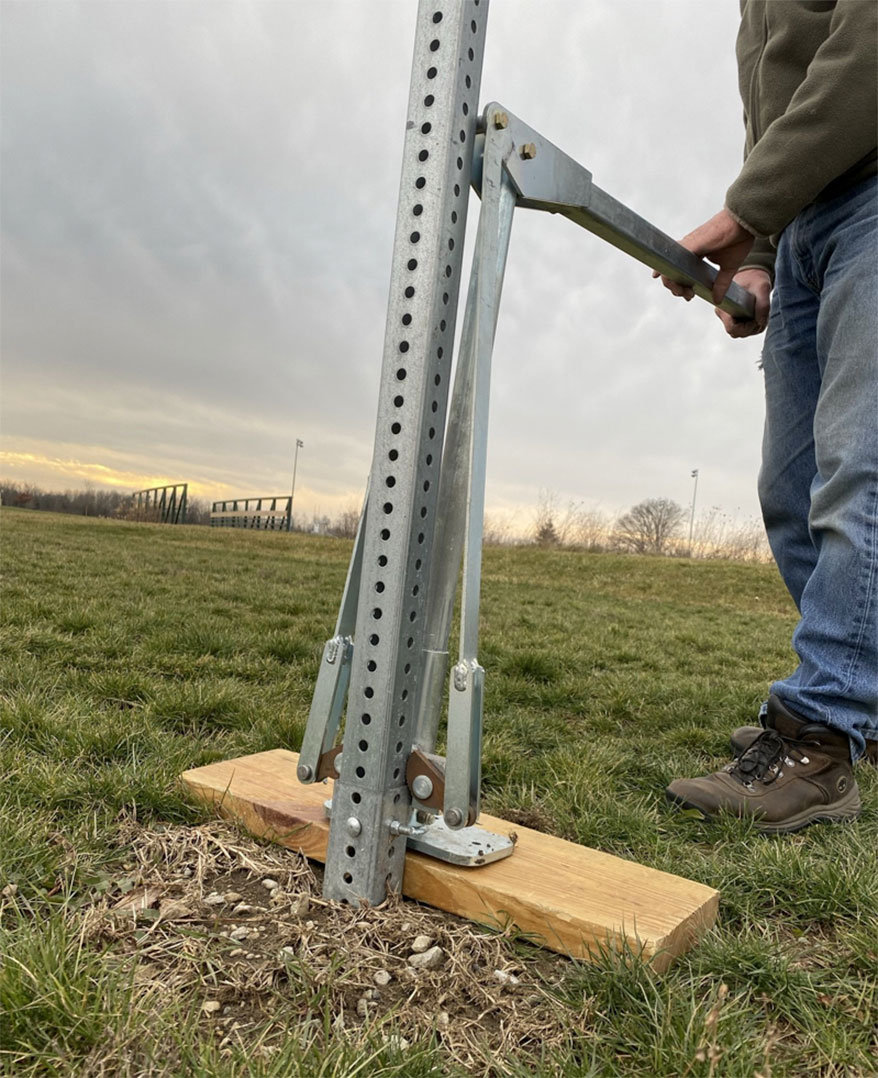 Installing a sign post, or removing one (as shown here) is made considerably easier by using tools designed specifically for the task.