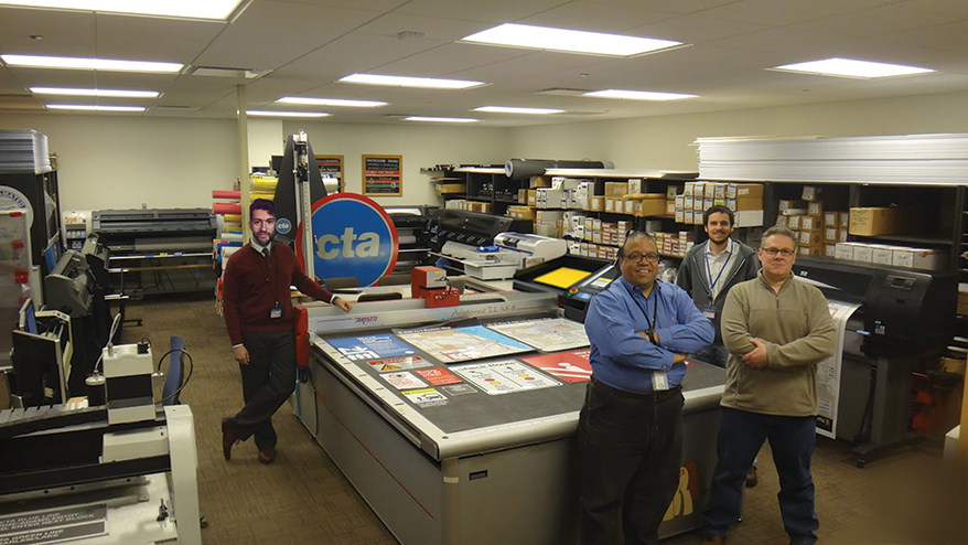 Members of CTA’s signage department (left to right): Nathaniel Matos, environmental graphic designer; Victor A. Ramirez, manager, signage & wayfinding; Michal Wyka, environmental graphic designer; Antonio Buccini, graphics production coordinator.
