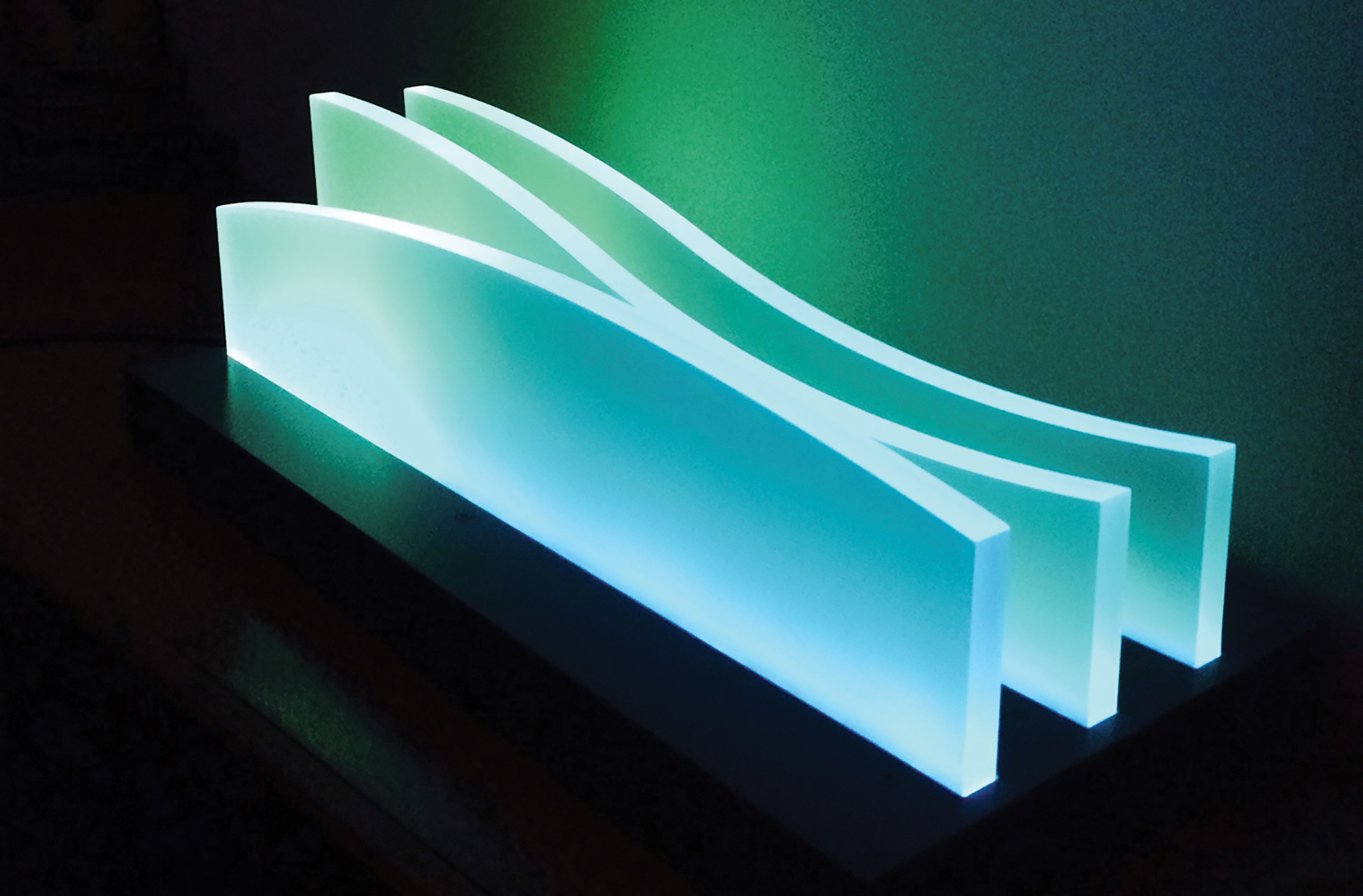 Hiding the hardware for the "Waves" light sculpture required a low-profile cabinet for the acrylic blades. 