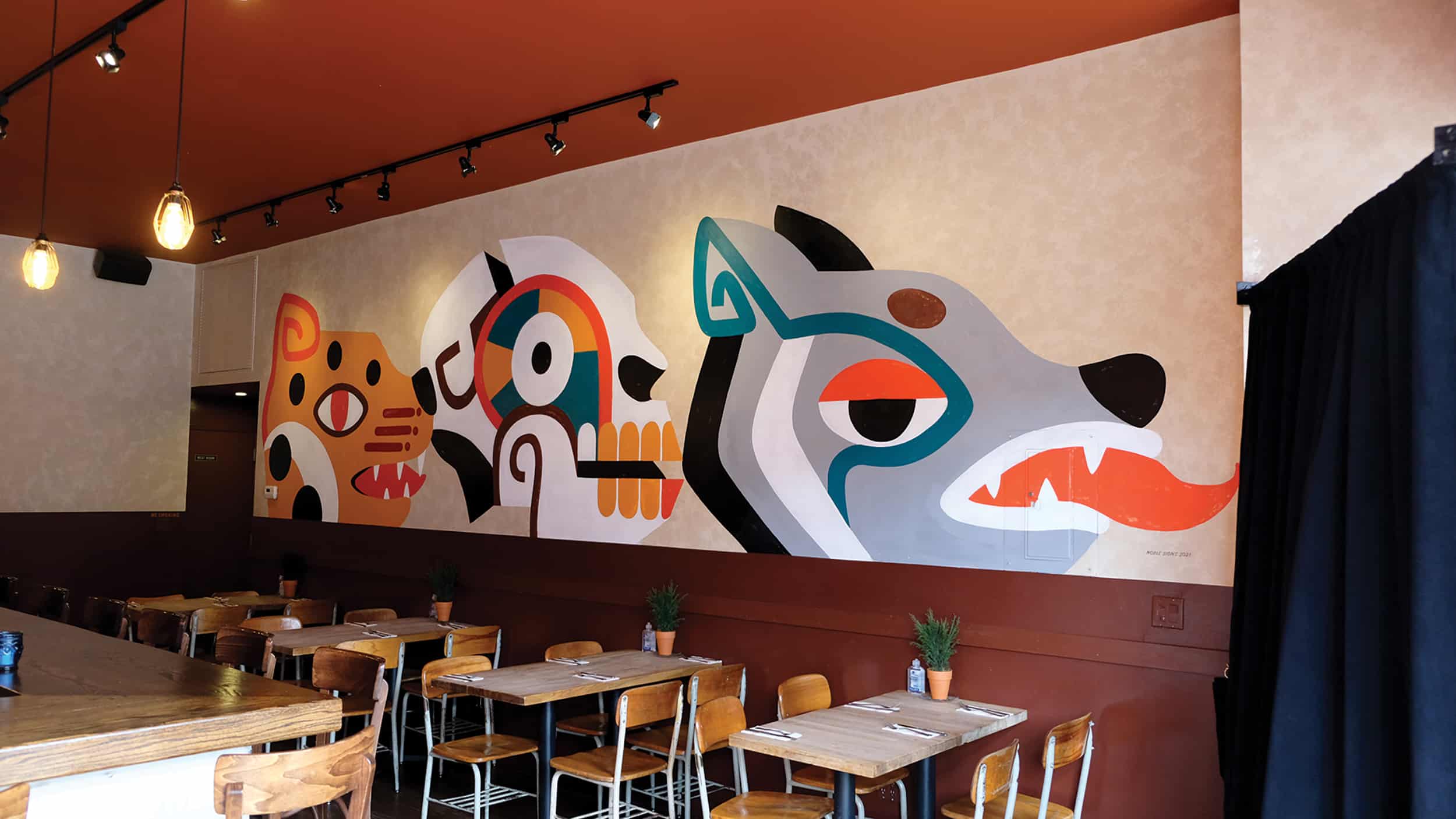 Head-Lines Without words This wall mural for a cantina conveys the brand without lettering.