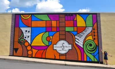 The mural is already a popular photo-ready spot for concert goers, residents and musical artists. Elayne Brick, owner of the Sellersville Theater, is on the right.